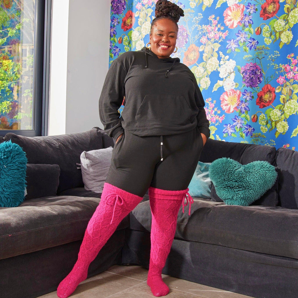 Woman wearing pink thigh high socks