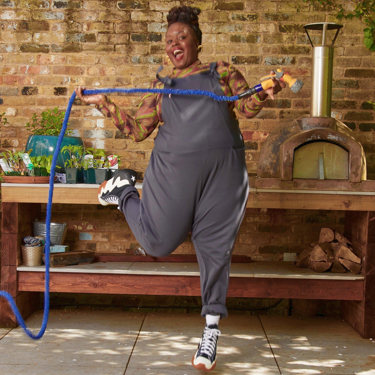 Woman wearing slate grey dungarees