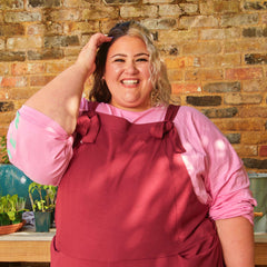 Woman wearing burgundy dungarees